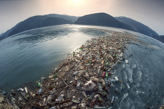 Fish-Eye Lense Image of Mountains Behind Ocean with Flow of Plastic