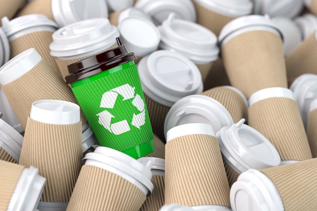 Littorary - green cup with recycling symbol in cluster of other cups